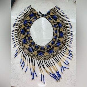 Handmade collar Necklace length: 16”Chain style: Bead Adjustable length